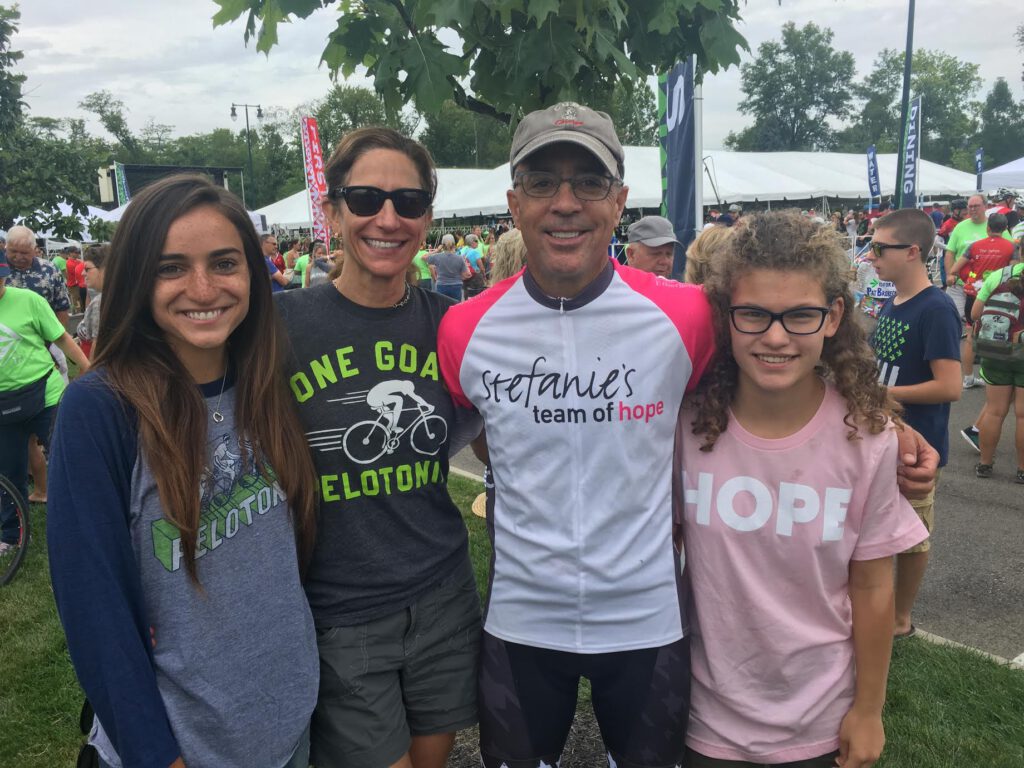 Dr. Derick and his family pose at the Pelotonia