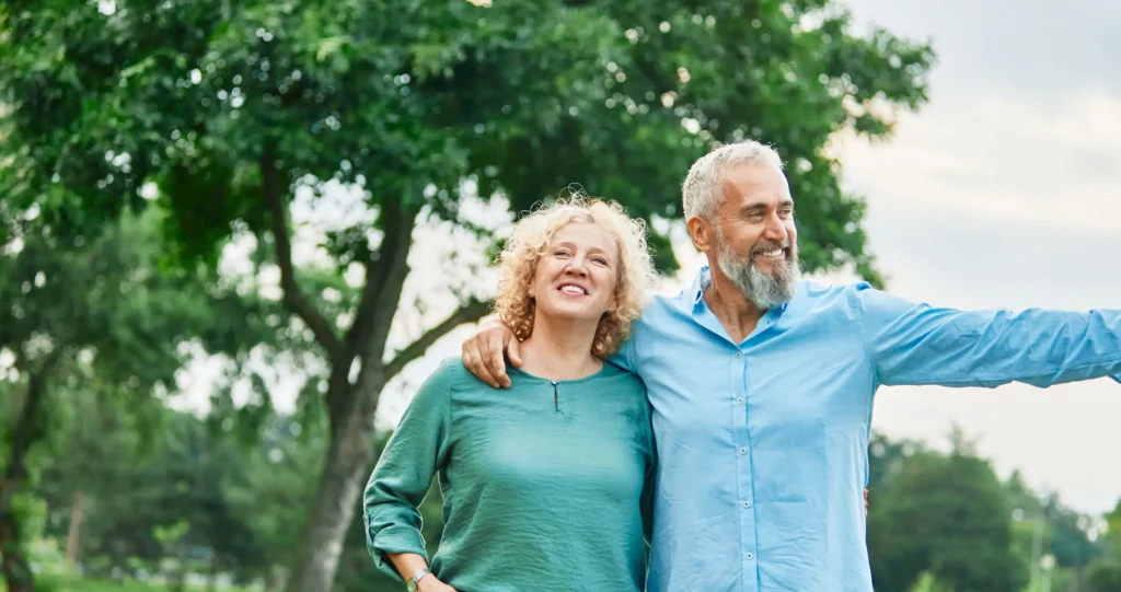 Happy couple walking in a park