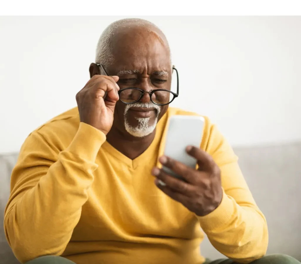 Senior Man Using Smartphone Wearing Eyeglasses